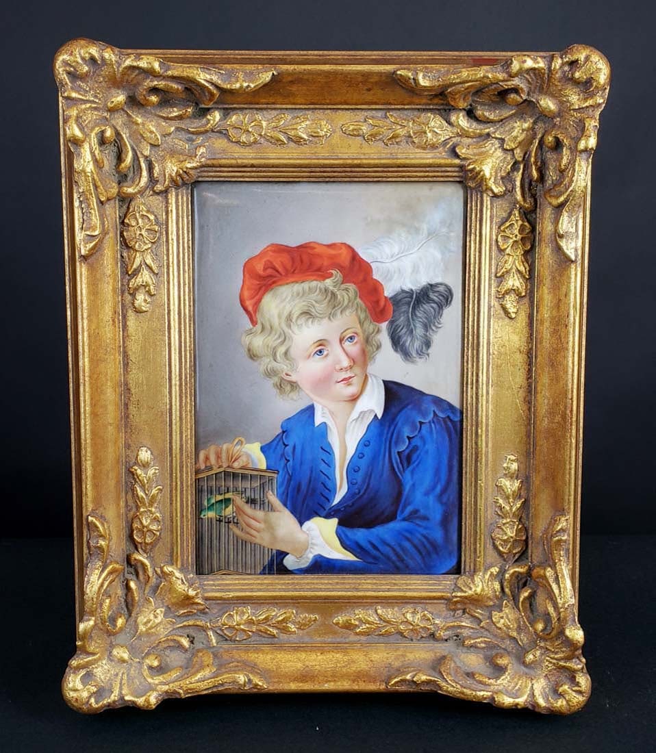 Dresden Plaque of Boy w/ Blue Jacket Holding Birdcage,: Dresden Plaque of Boy w/ Blue Jacket Holding Birdcage, Circa 1900. The frame measures 15 1/2" x 12" and plaque measures 10" x 7"
