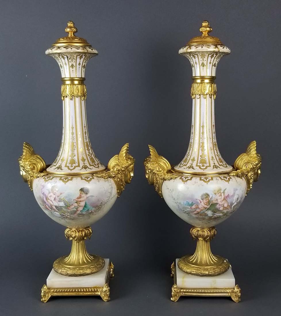 Pair of Large Sevres Bronze Mounted Figural Urns, 19th: Pair of Large Sevres Bronze Mounted Figural Urns, 19th C. They measure H: 21" W: 9 1/2"