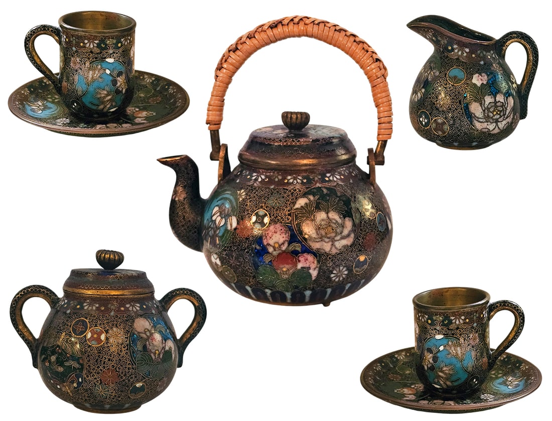 Japanese Cloisonne Enamel Tea Set Dated (1868-1912) Meiji Period: Japanese Cloisonne Enamel Tea Set Dated (1868-1912) Meiji Period. Set features intricate floral, butterfly, and scrolling designs on a black background with gilded copper. Big Tea Pot: H 3" x W 3" x