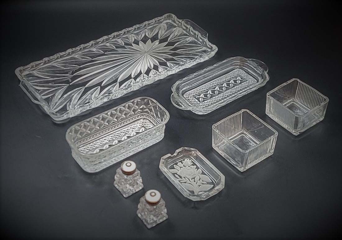 8 Items Lot, Crystal Pieces: 8 Items Lot, Crystal Pieces. Large Tray: L 14" x W 6" \ Centerpiece: H 1 1/2" x L 6 1/2" x W 3" \ Tray: H 1" x L 8" x W 3 1/2" \ Pair Of Square Cups: H 2" x W 3" x L 3" \ Pair Of Salt Shaker: H 2" \