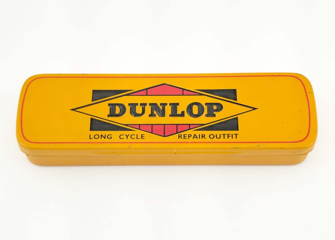 Dunlop Tire Repair kit 'Long Cycle Repair Outfit' 1940s-1950's Circa: Dunlop Tire Repair kit 'Long Cycle Repair Outfit' 1940s-1950's Circa. Made In England. H 7/8" x W 1 1/2" x L 4 1/2"