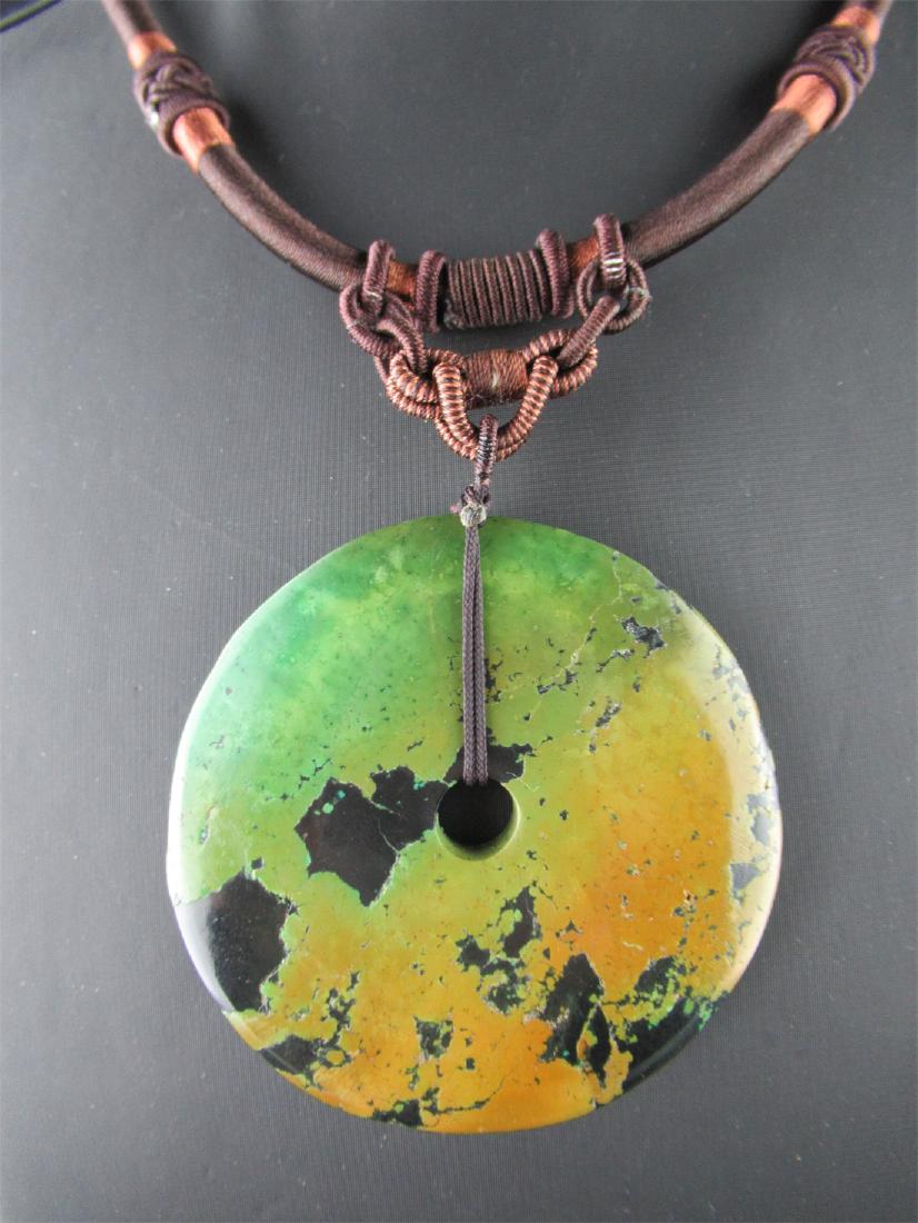 Turquoise Pendant: Turquoise Pendant on a Brown Cord, with Braided Bail, Dimensions: 2.6" (L) x 2.6" (W) x 0.2" (D), Necklace Length: 11", Weight: 51.5g