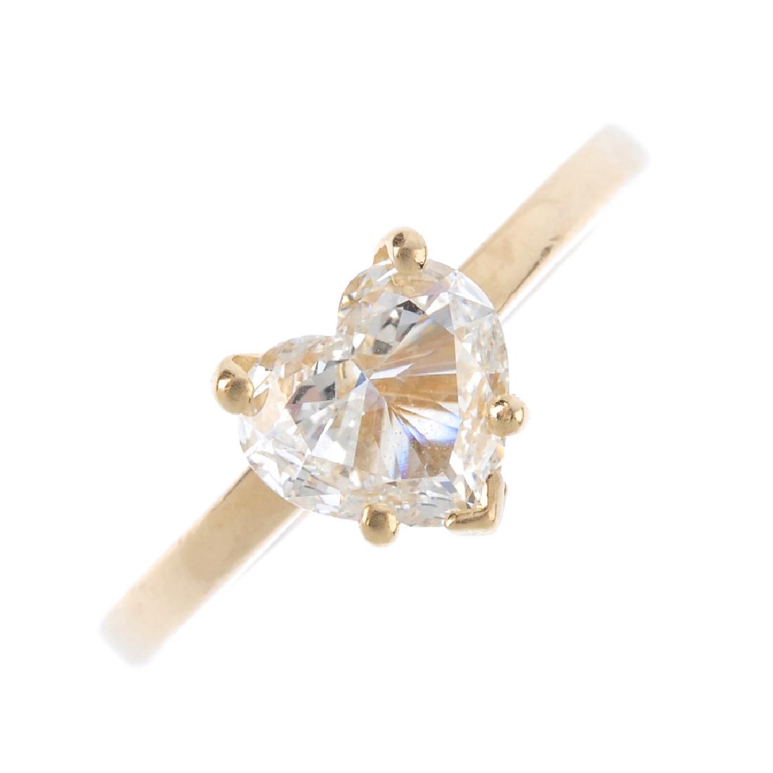 A diamond single-stone ring. The heart-shape diamond, (1 of 3)