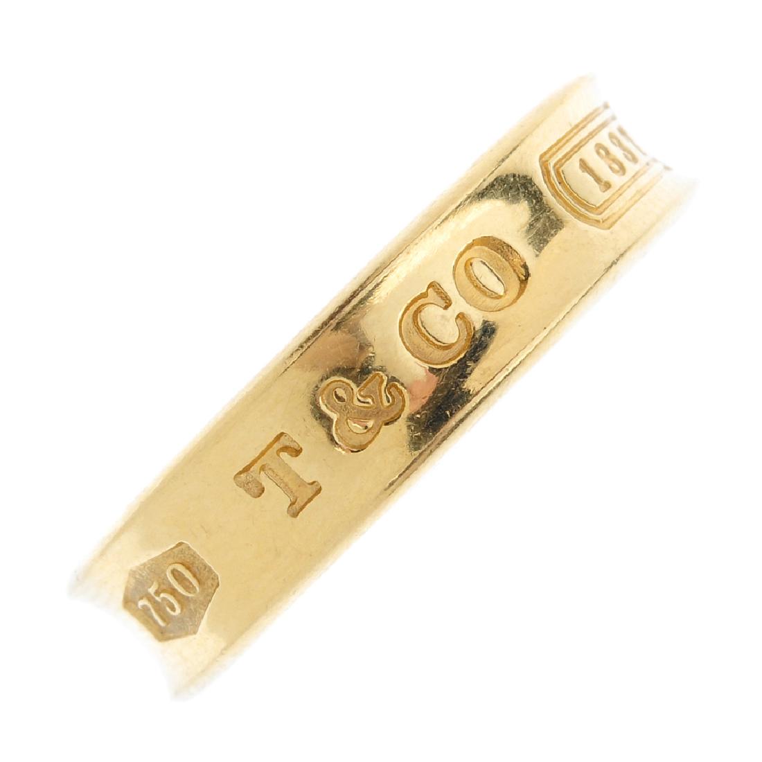 TIFFANY & CO. - an '1837' band ring. The tapered band, (1 of 2)