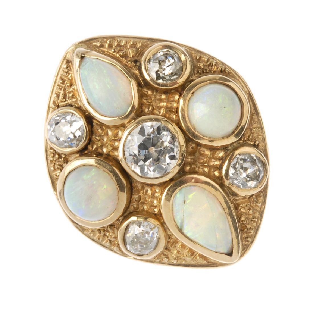 A diamond and opal dress ring. The marquise-shape (1 of 2)