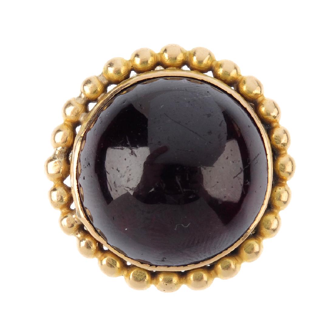 A garnet ring. The circular-shape cabochon, with (1 of 3)