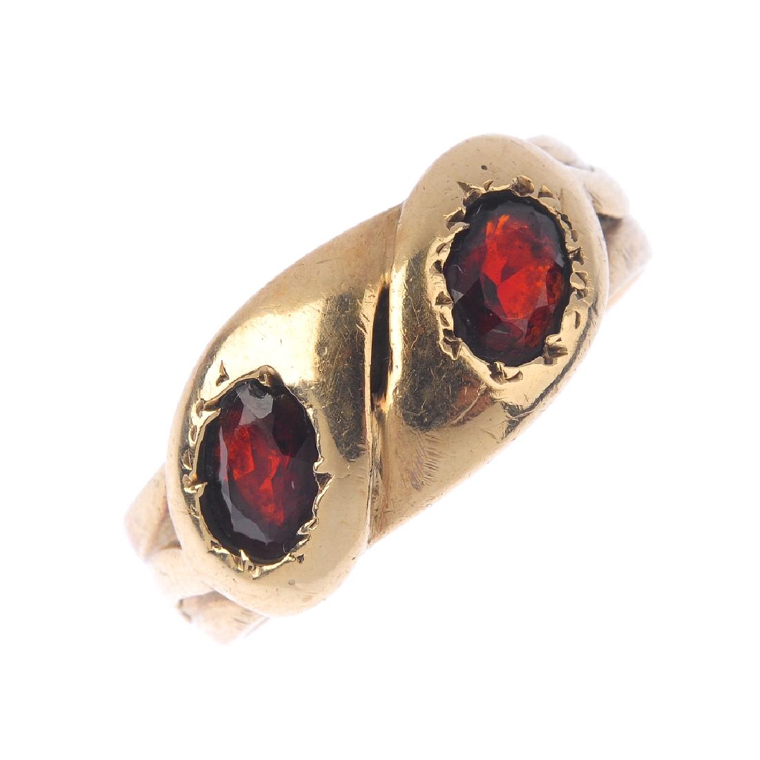 An early 20th century gold garnet snake ring. (1 of 3)