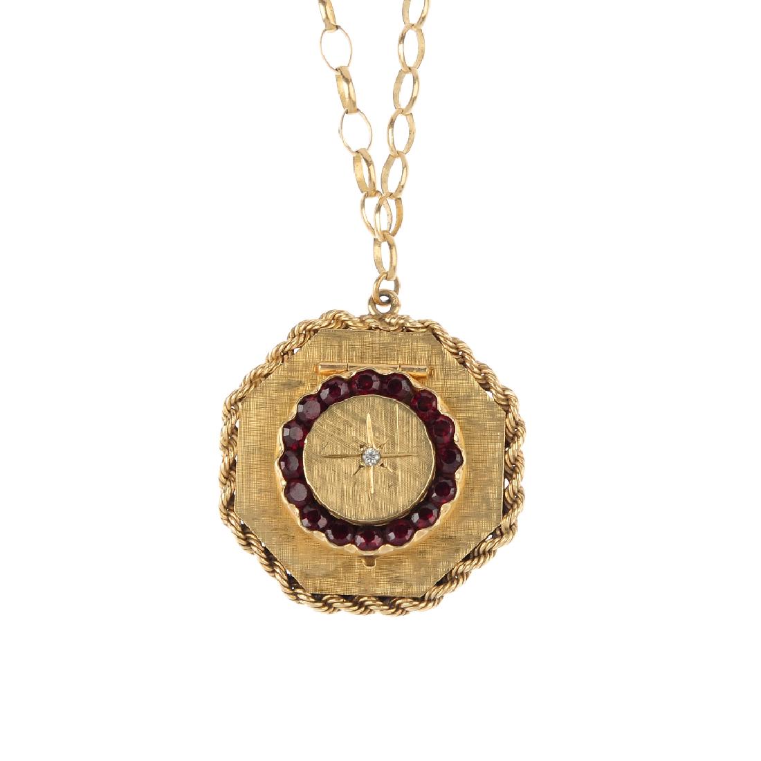 A gem-set locket. Of hexagonal outline, the textured (1 of 3)