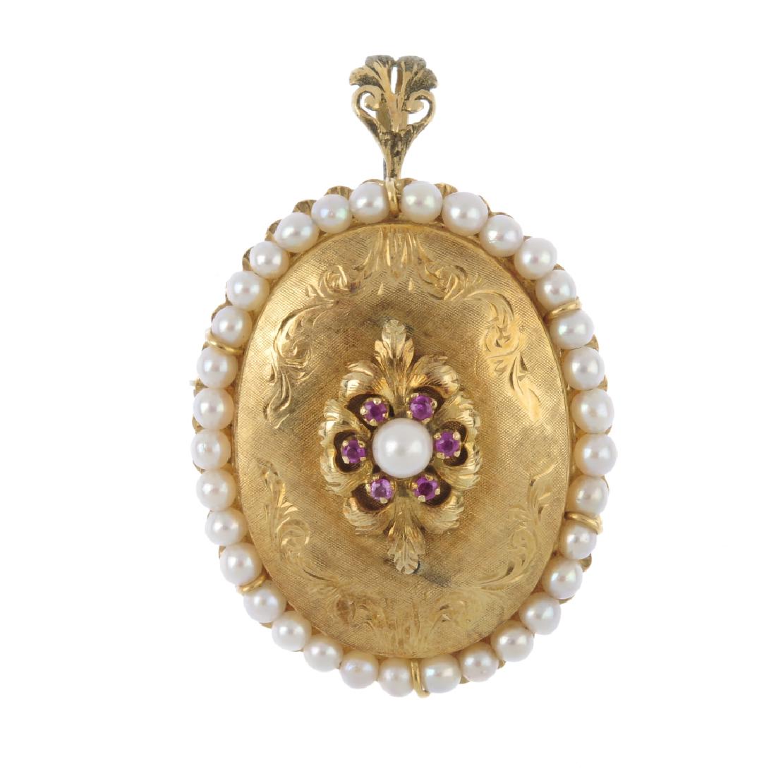 A 18ct cultured pearl and ruby pendant. Of oval (1 of 2)