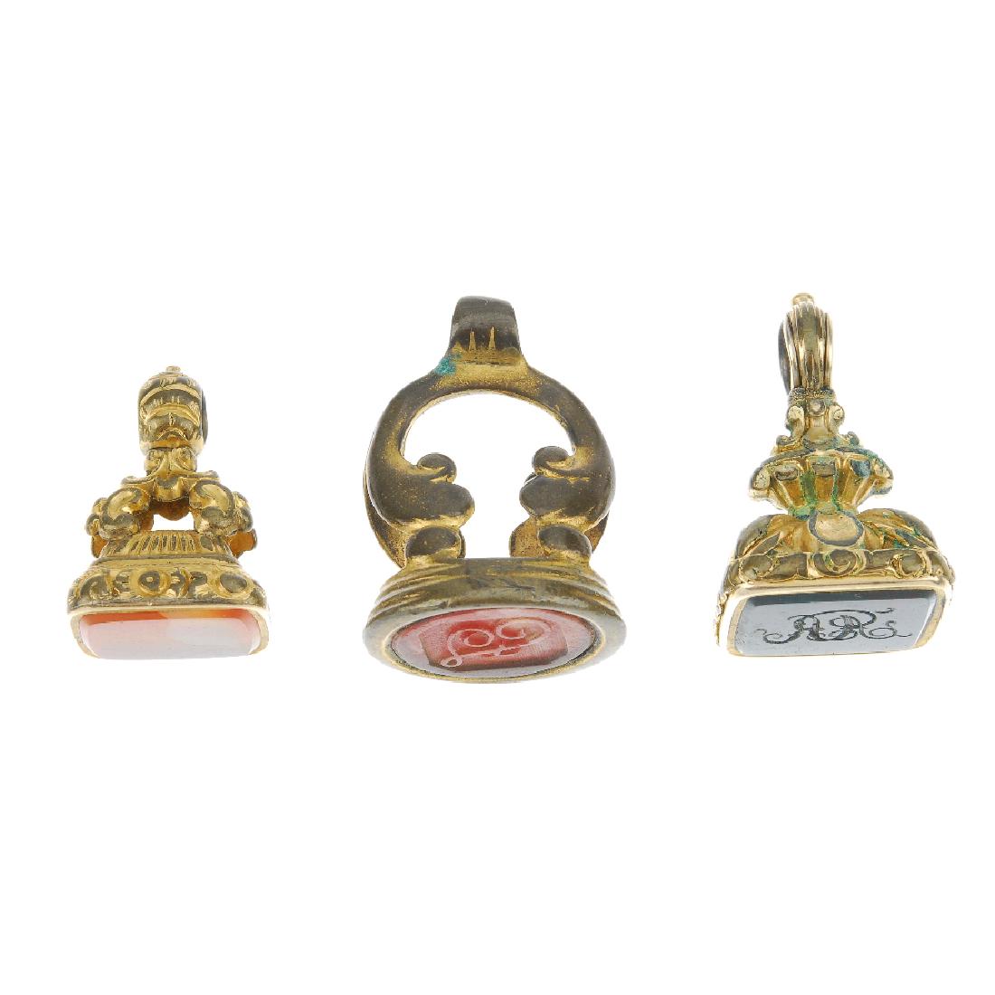 A selection of fobs. To include an intaglio fob reading: A selection of fobs. To include an intaglio fob reading 'John', to the foliate pedestal, another depicting a warrior in profile. Lengths 1.7 to 4.5cms.