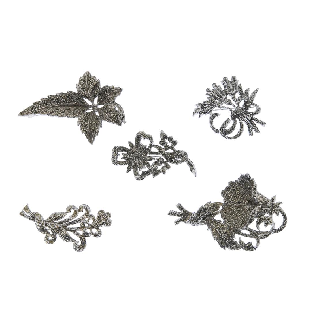 A selection of marcasite jewellery. To include animal: A selection of marcasite jewellery. To include animal and floral brooches, together with various earrings, bracelets and necklaces. (42 and 14 single earrings).