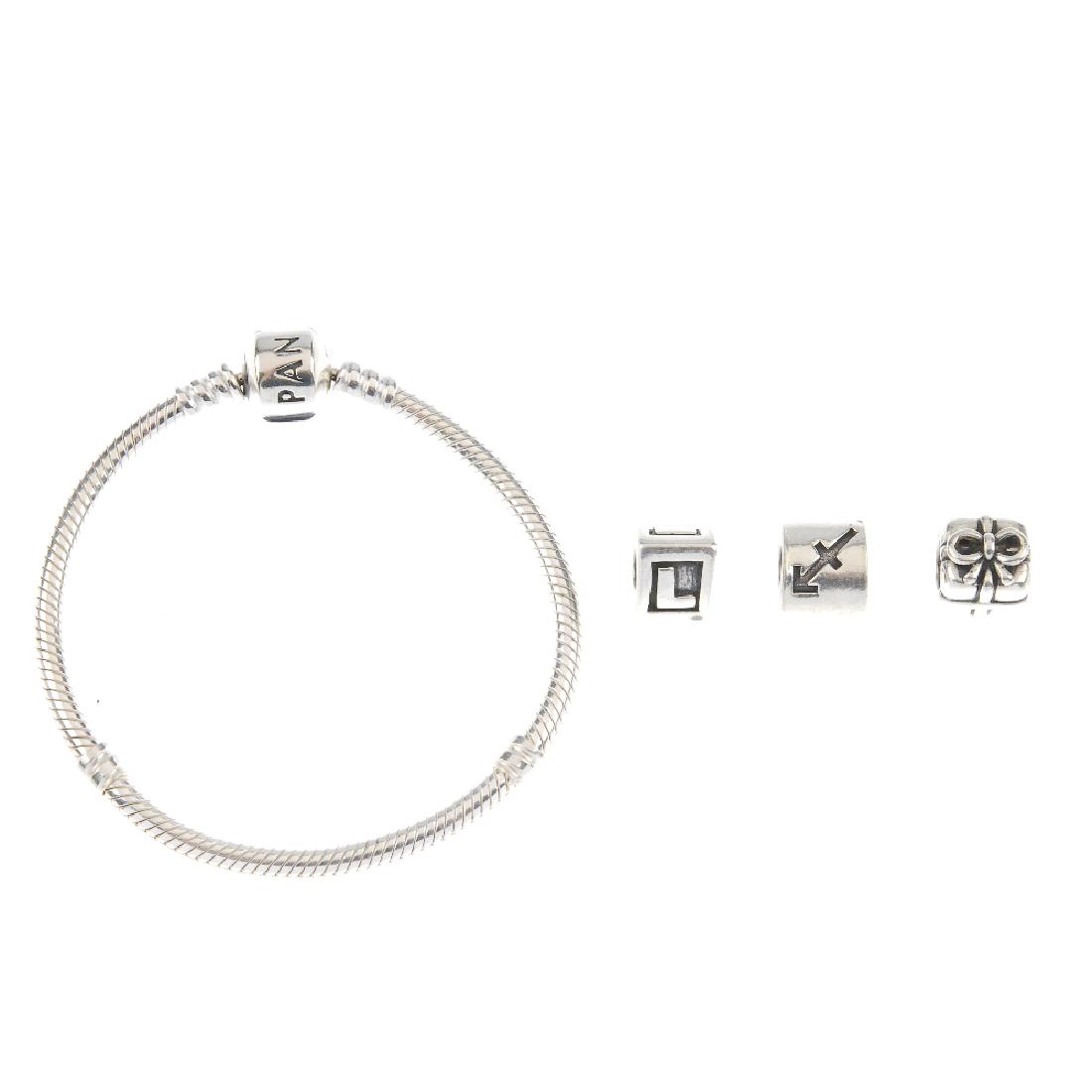 PANDORA - two charm bracelets with ten loose charms. (1 of 4)