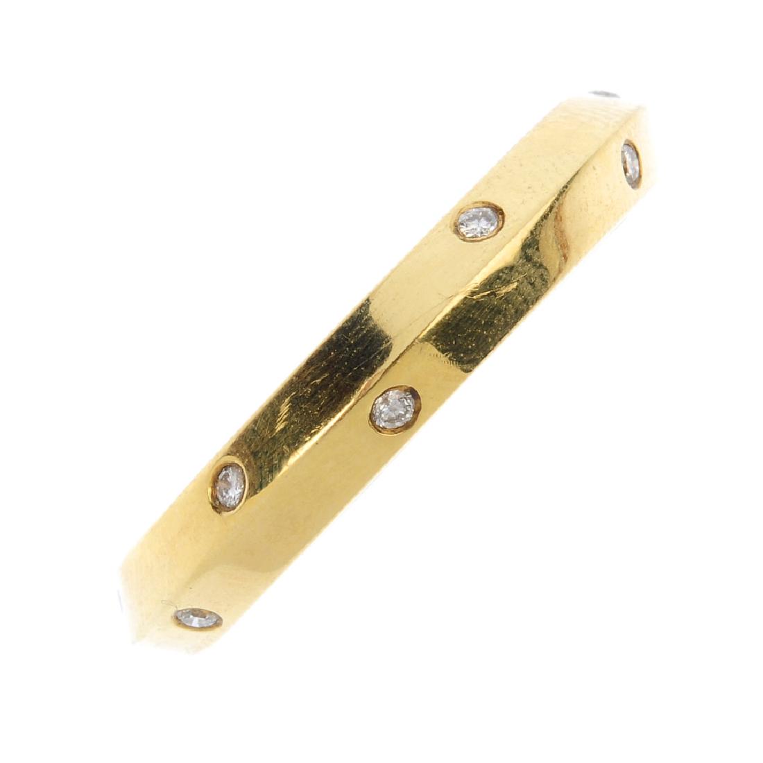 An 18ct gold diamond band ring. The angular band, with (1 of 2)