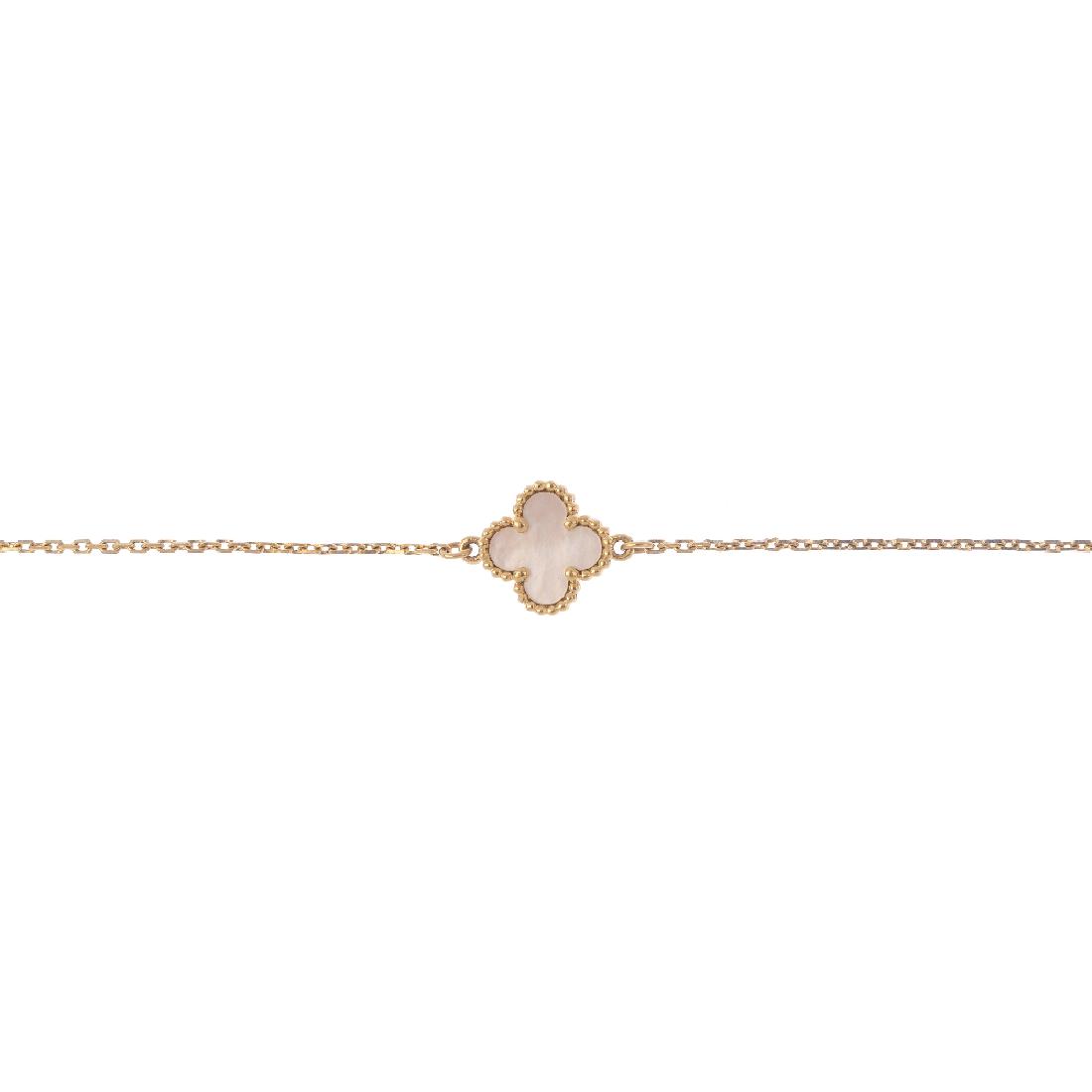 VAN CLEEF & ARPELS - an 18ct gold 'Alhambra' bracelet. (1 of 3)