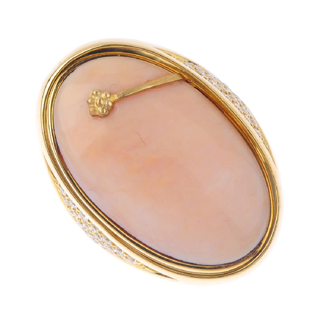 An 18ct gold dress ring. Designed as an oval onyx and (1 of 5)