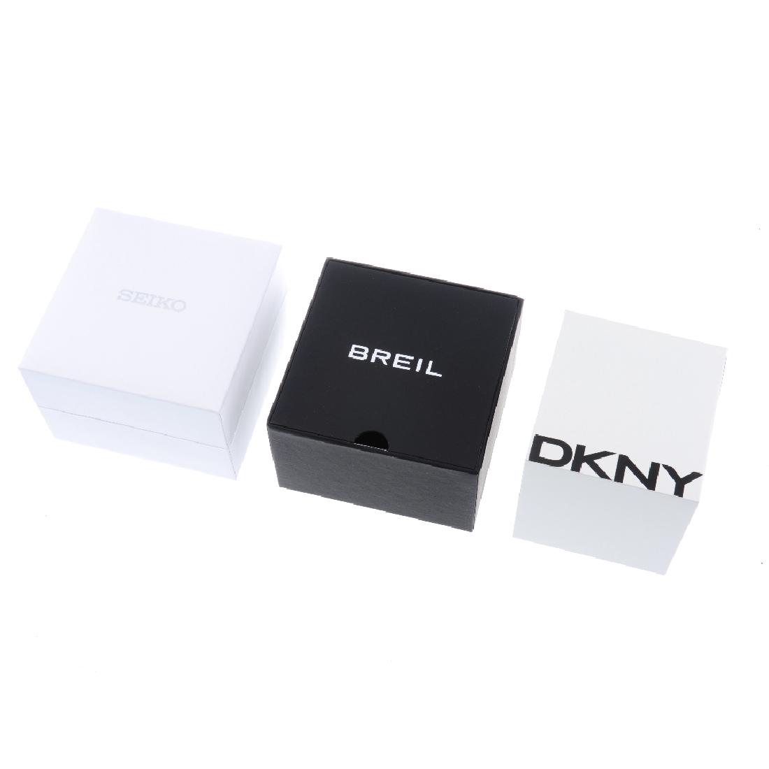 A group of assorted watch boxes, to include examples by: A group of assorted watch boxes, to include examples by Fossil, DKNY, Sekio and Skagen, some incomplete. Approximately 55.