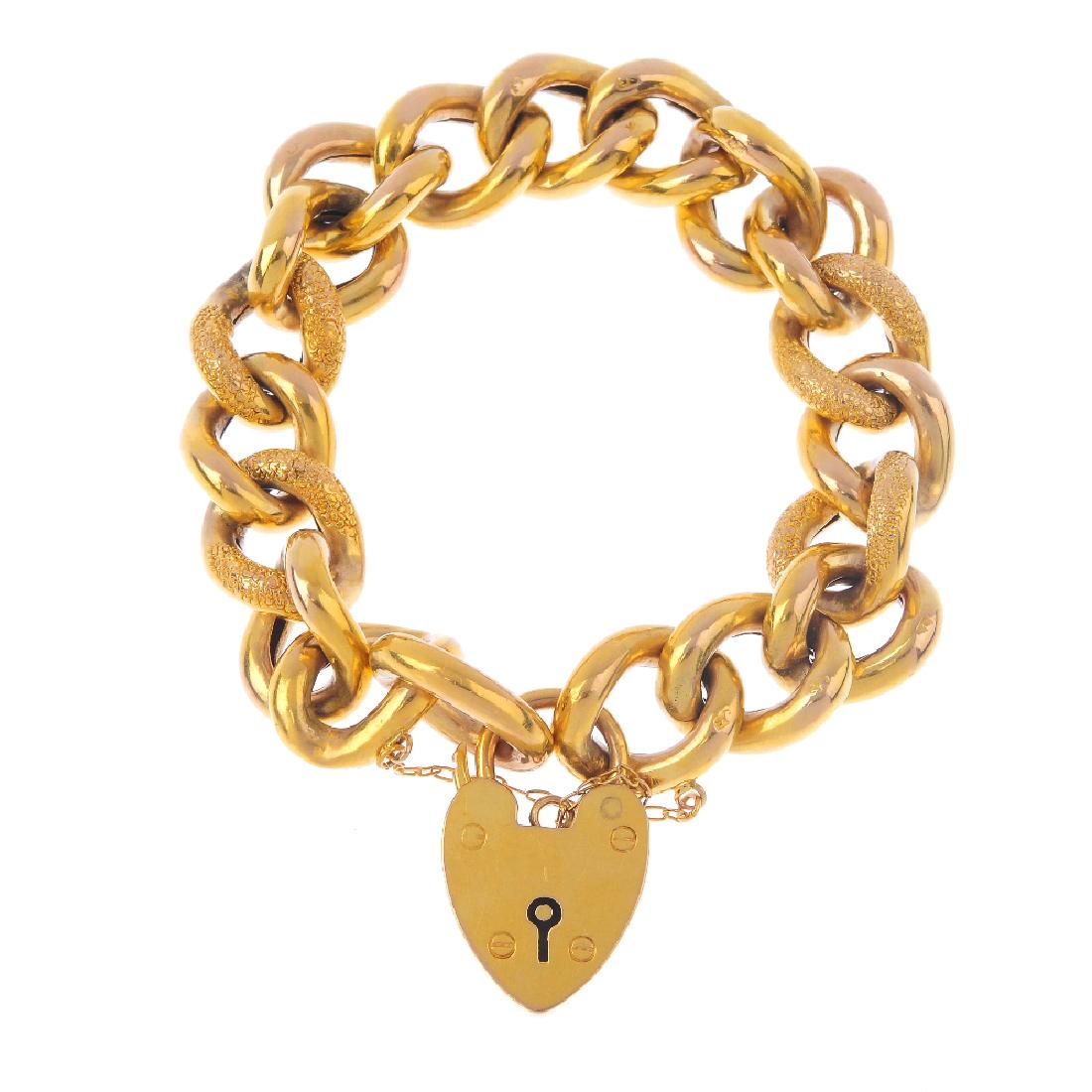 An early 20th century 9ct gold bracelet. The curb-link: An early 20th century 9ct gold bracelet. The curb-link chain, with alternately textured links, to the padlock clasp. Length 18.5cms. Weight 23.5gms.