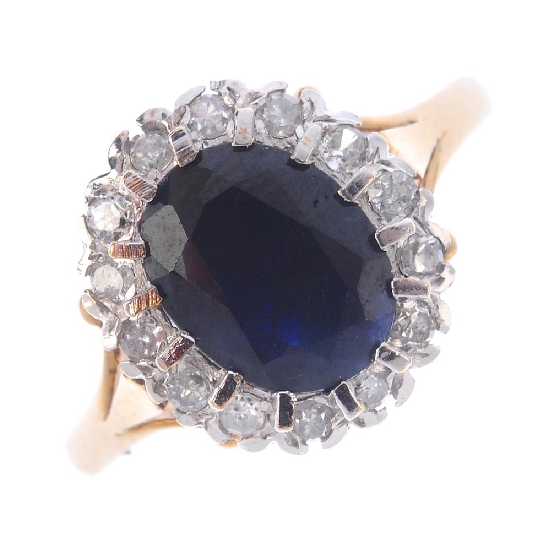 A 9ct gold sapphire and diamond cluster ring. The (1 of 3)
