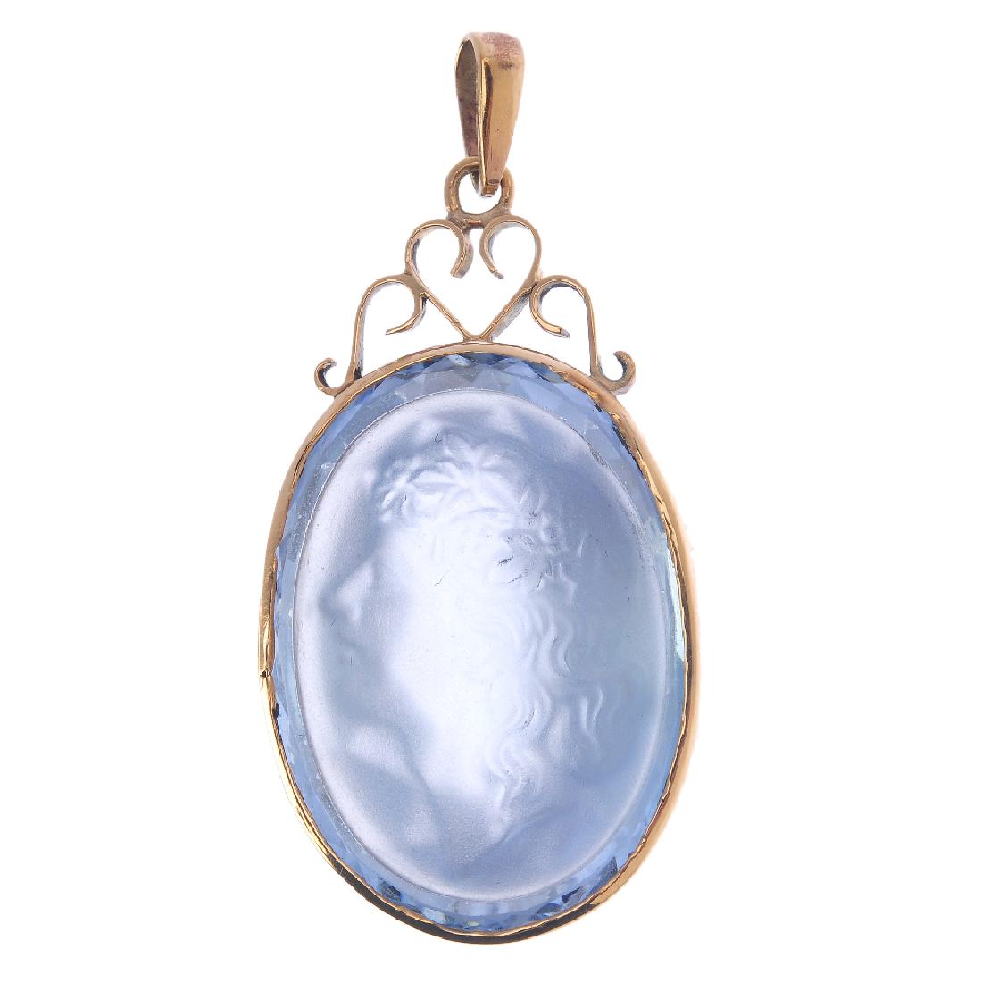 A synthetic spinel pendant. The oval-shape blue (1 of 2)