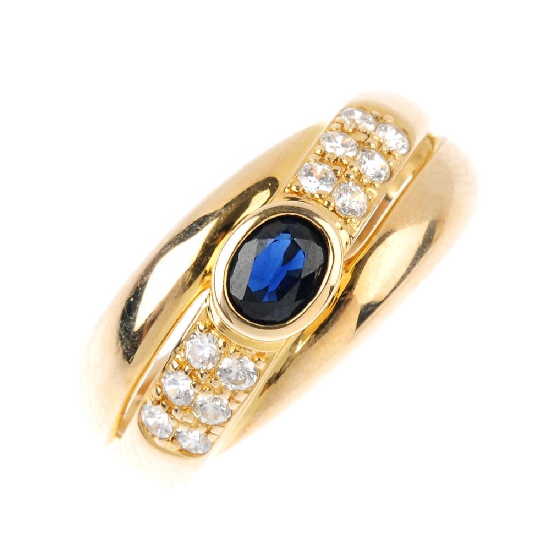 An 9ct gold sapphire and cubic zirconia ring. The (1 of 4)
