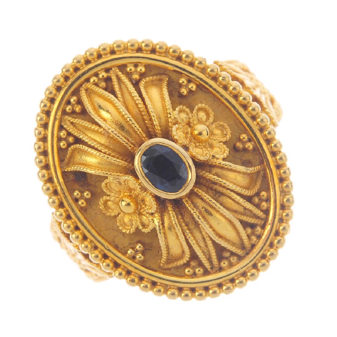 A sapphire dress ring. Of oval outline, the oval-shape (1 of 3)