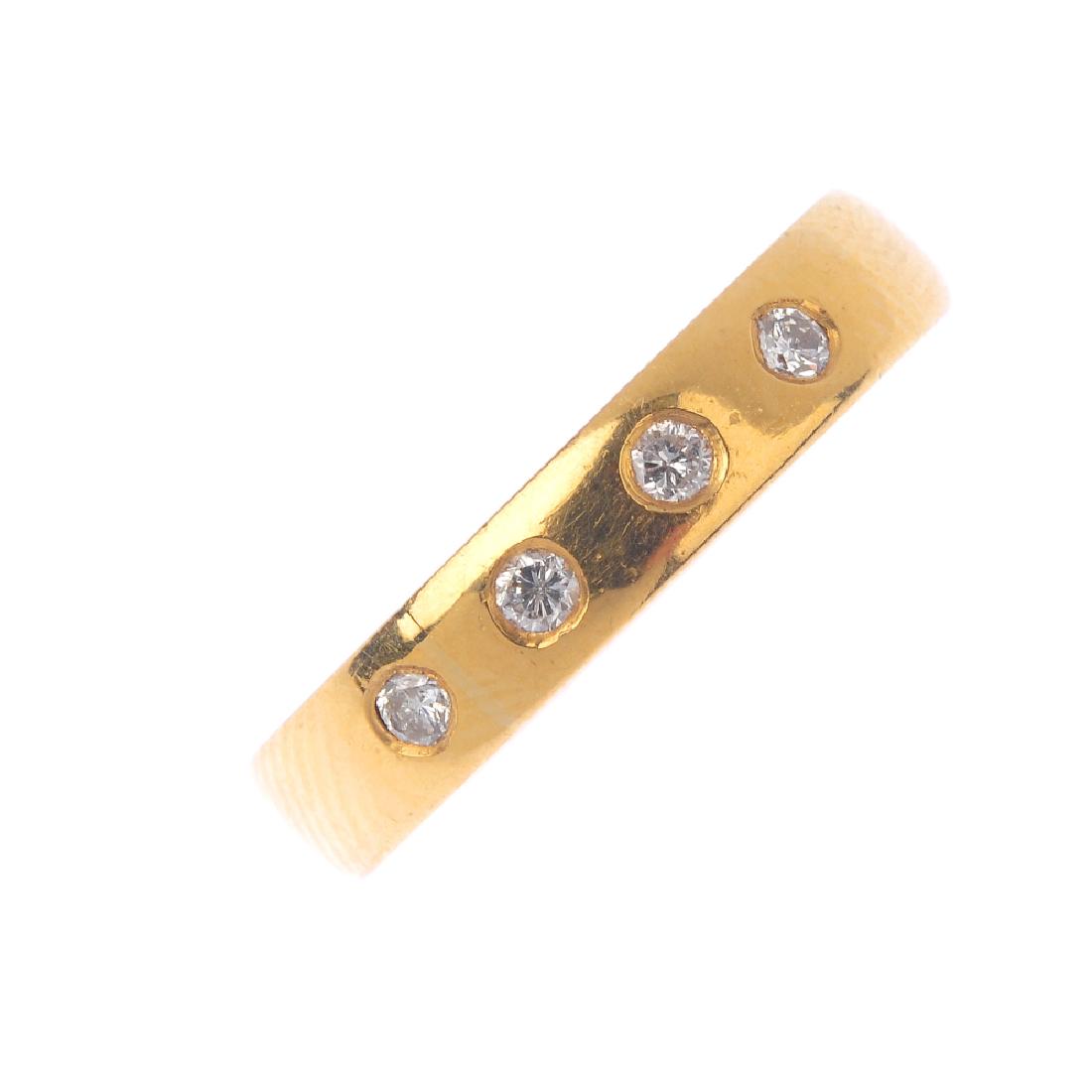 A 22ct gold diamond band ring. Designed as four (1 of 3)