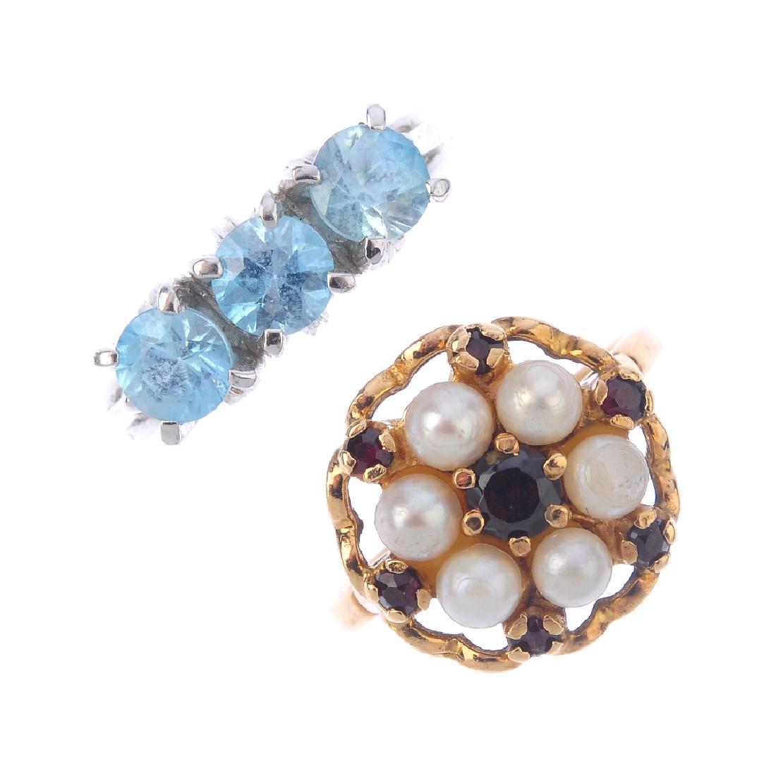 Four 9ct gold gem-set rings. To include a blue zircon (1 of 4)