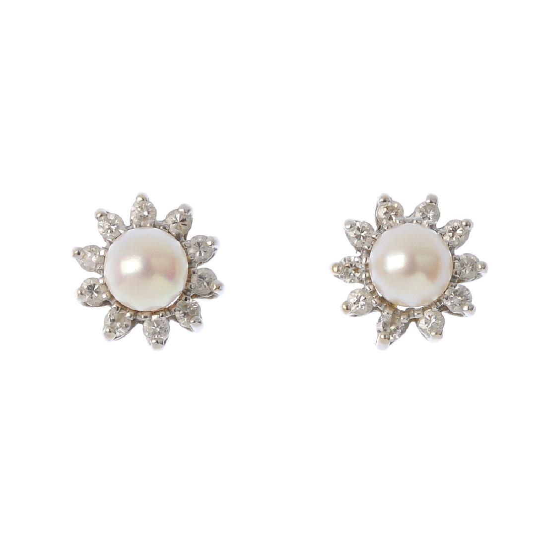 A pair of cultured pearl and diamond cluster earrings. (1 of 2)