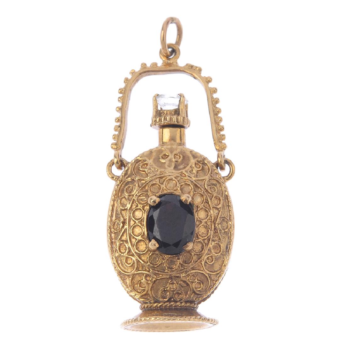 A 9ct gold scent bottle pendant. The scrolling embossed (1 of 3)