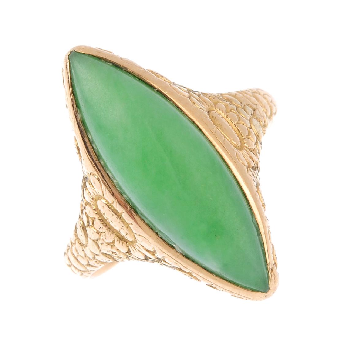A gem-set ring. The marquise-shape green gem cabochon, (1 of 3)