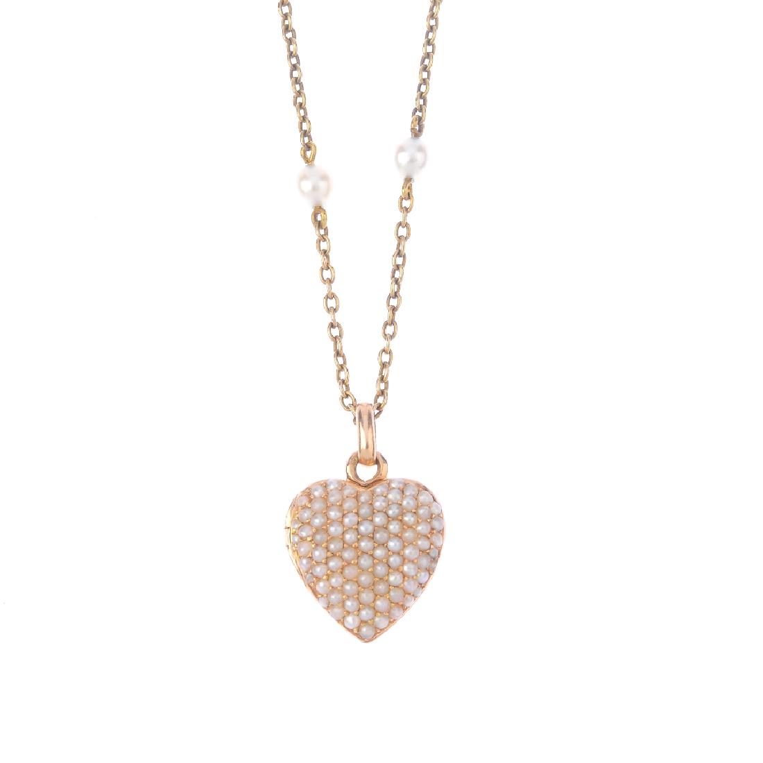 A split pearl locket. The pave-set split pearl heart, (1 of 3)