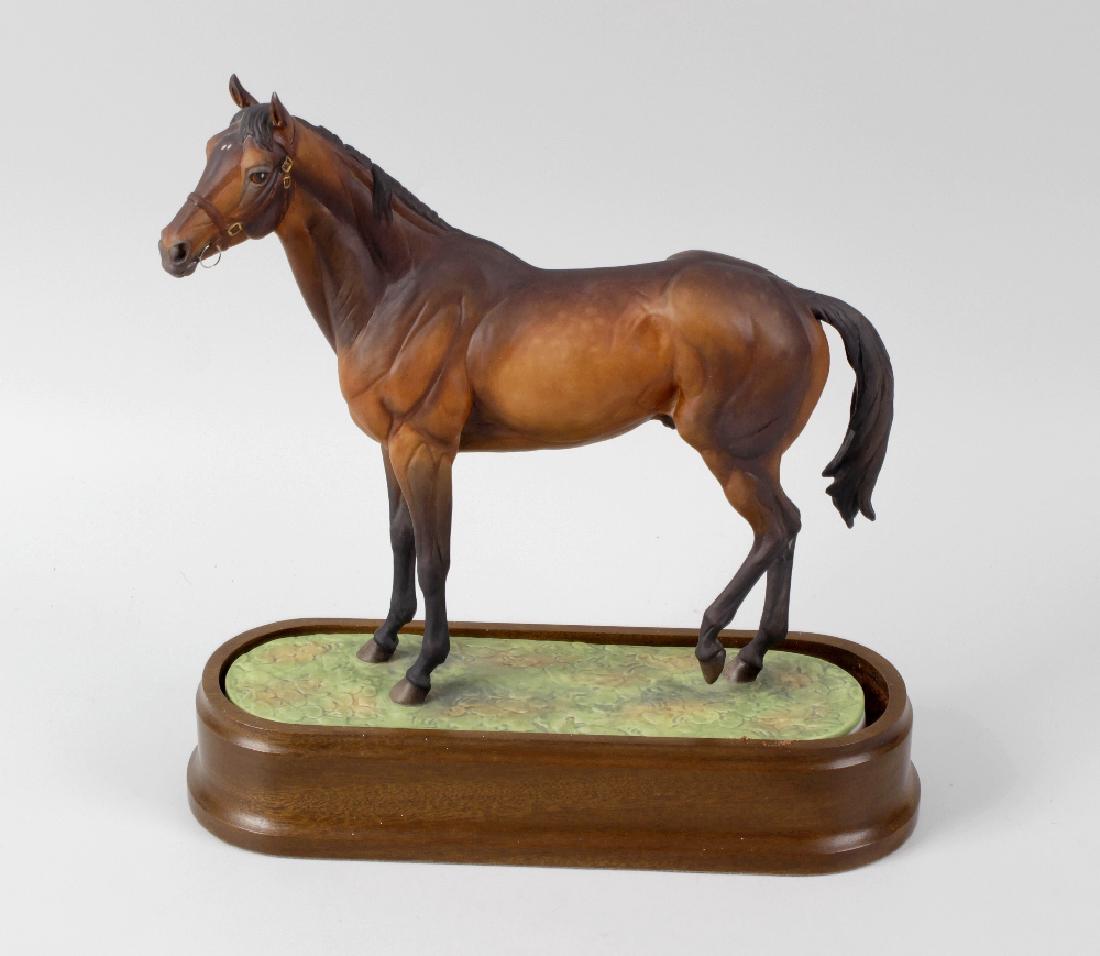 A Royal Worcester porcelain model of Mill Reef.: A Royal Worcester porcelain model of Mill Reef. Modelled by Doris Lindner, 1974, black printed marks, numbered 150, 9.75, (24.5cm) high, with wooden plinth.