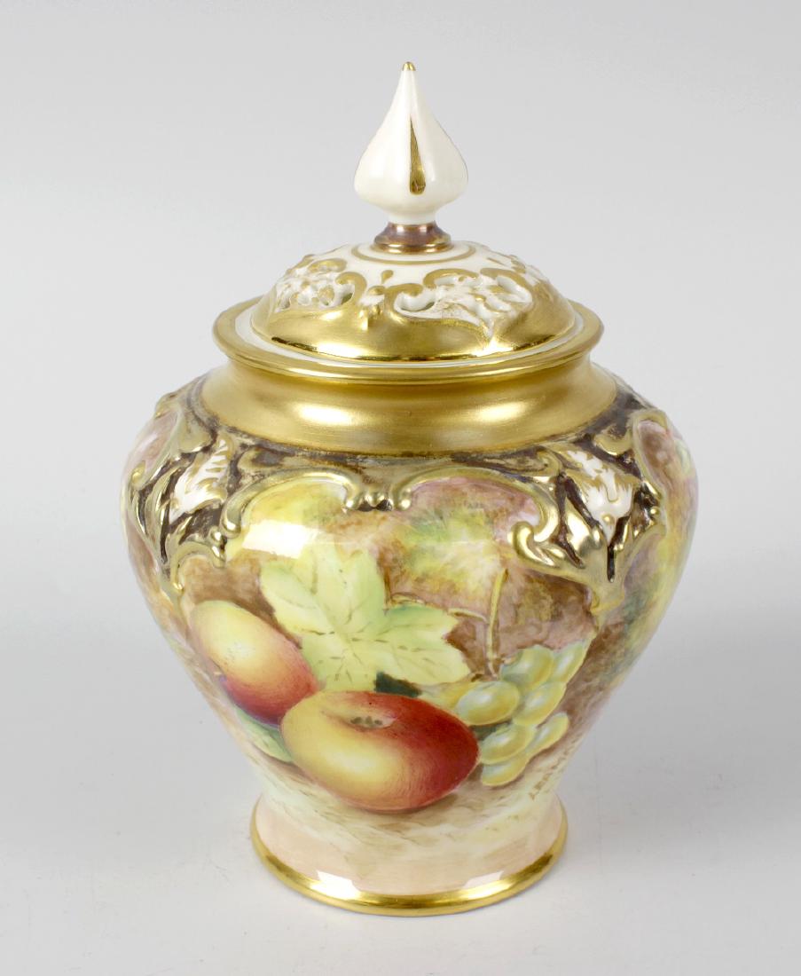 A small Royal Worcester porcelain fruit-painted pot: A small Royal Worcester porcelain fruit-painted pot pourri vase and cover by Leaman. The four-lobed squat balustroid body painted to one side with peaches and green grapes, to the other with plums, bl