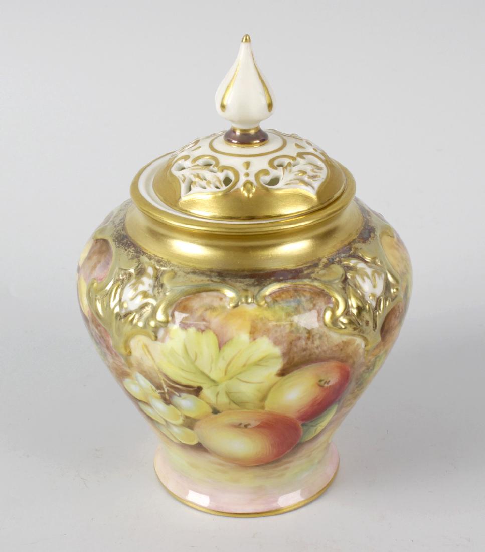 A small Royal Worcester porcelain fruit-painted pot: A small Royal Worcester porcelain fruit-painted pot pourri vase and cover by Leaman. The four-lobed squat balustroid body painted to one side with peaches and green grapes, to the other with plums, bl