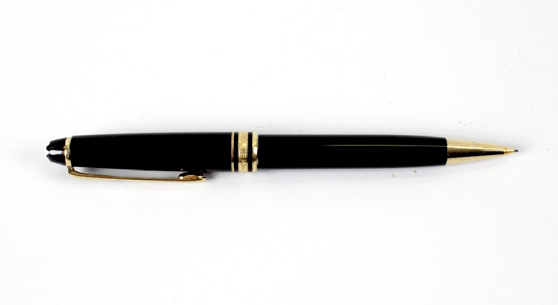 A Montblanc Meisterstuck retractable pencil. With black: A Montblanc Meisterstuck retractable pencil. With black resin body in presentation box containing refill, and leather pouch, both in card box of issue.
