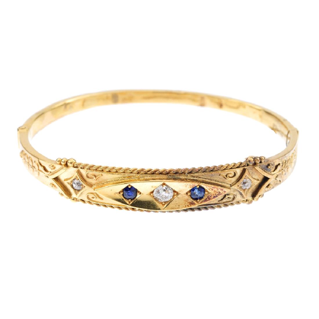A late Victorian 15ct gold diamond and sapphire hinged (1 of 2)