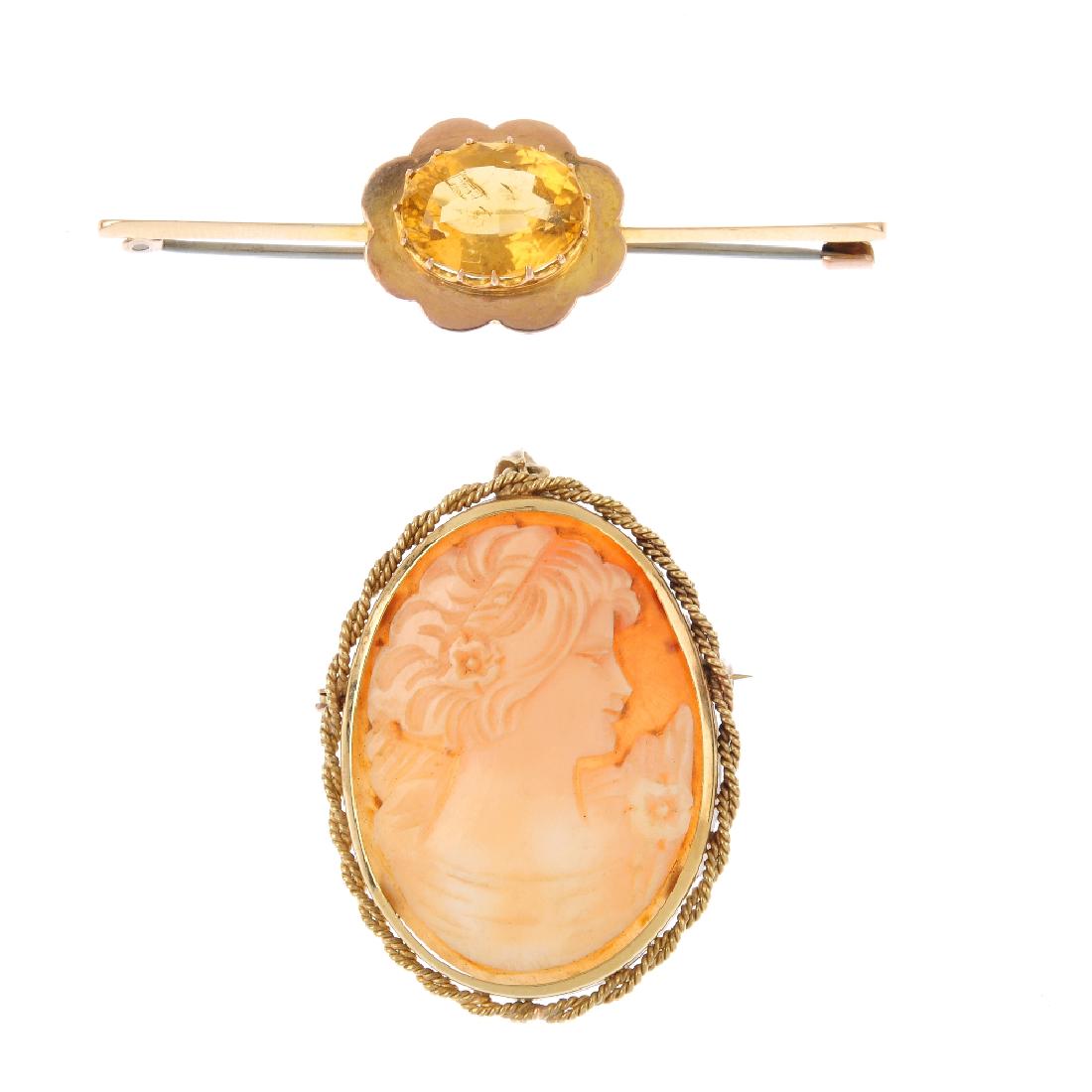 A 9ct gold cameo brooch and a citrine brooch. The shell (1 of 2)