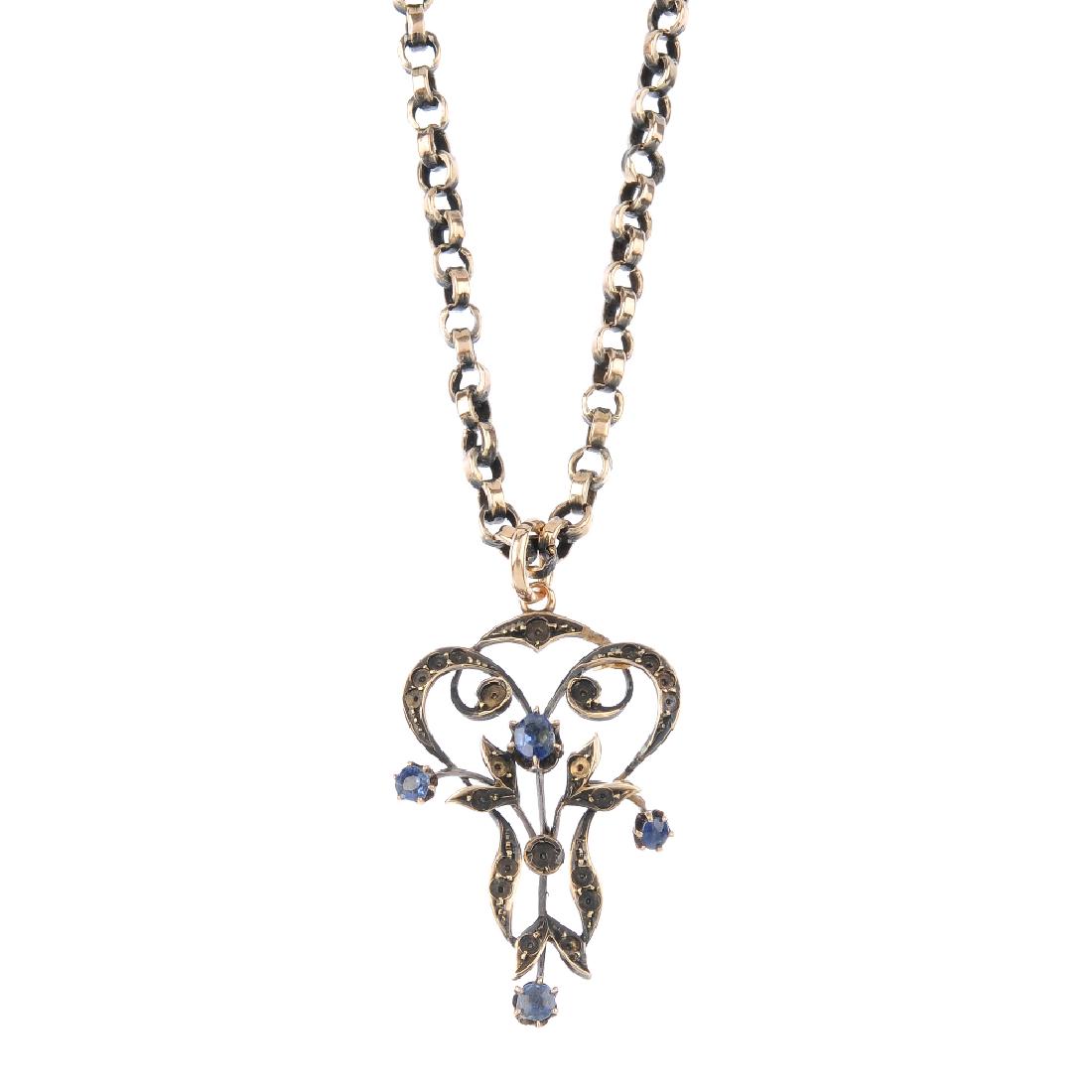 A sapphire pendant. Of openwork design, the central (1 of 3)