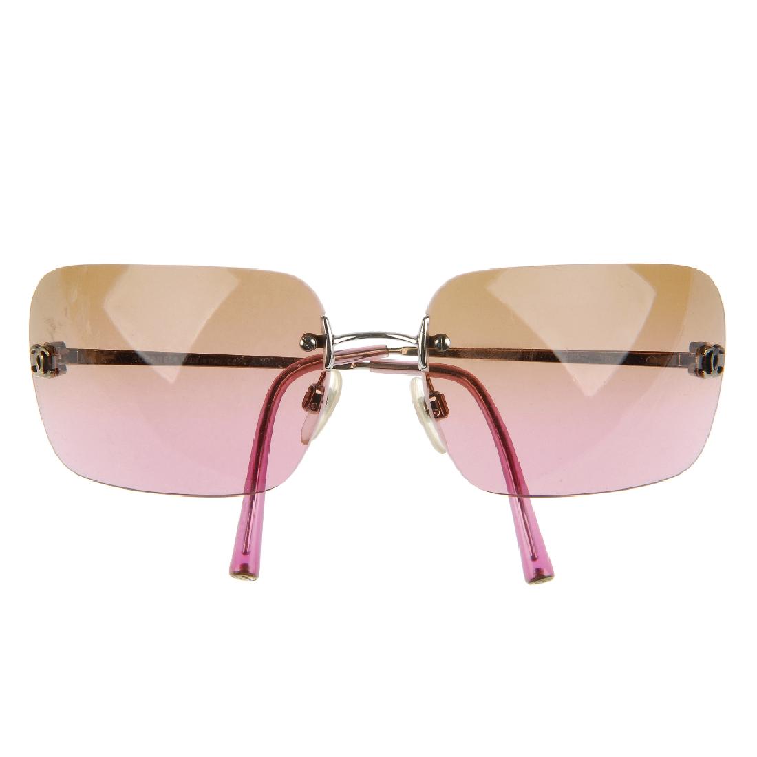 CHANEL - a pair of rimless sunglasses. Designed with (1 of 4)