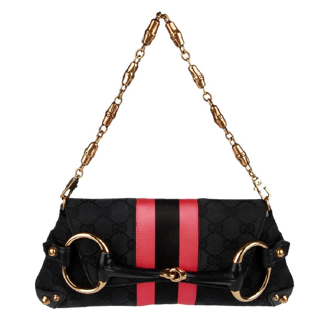 GUCCI by Tom Ford - a Horsebit clutch. Designed with: GUCCI by Tom Ford - a Horsebit clutch. Designed with maker's black monogram canvas exterior, smooth black leather trim, bronze-tone hardware accents, with a neon pink and black central satin stripe an