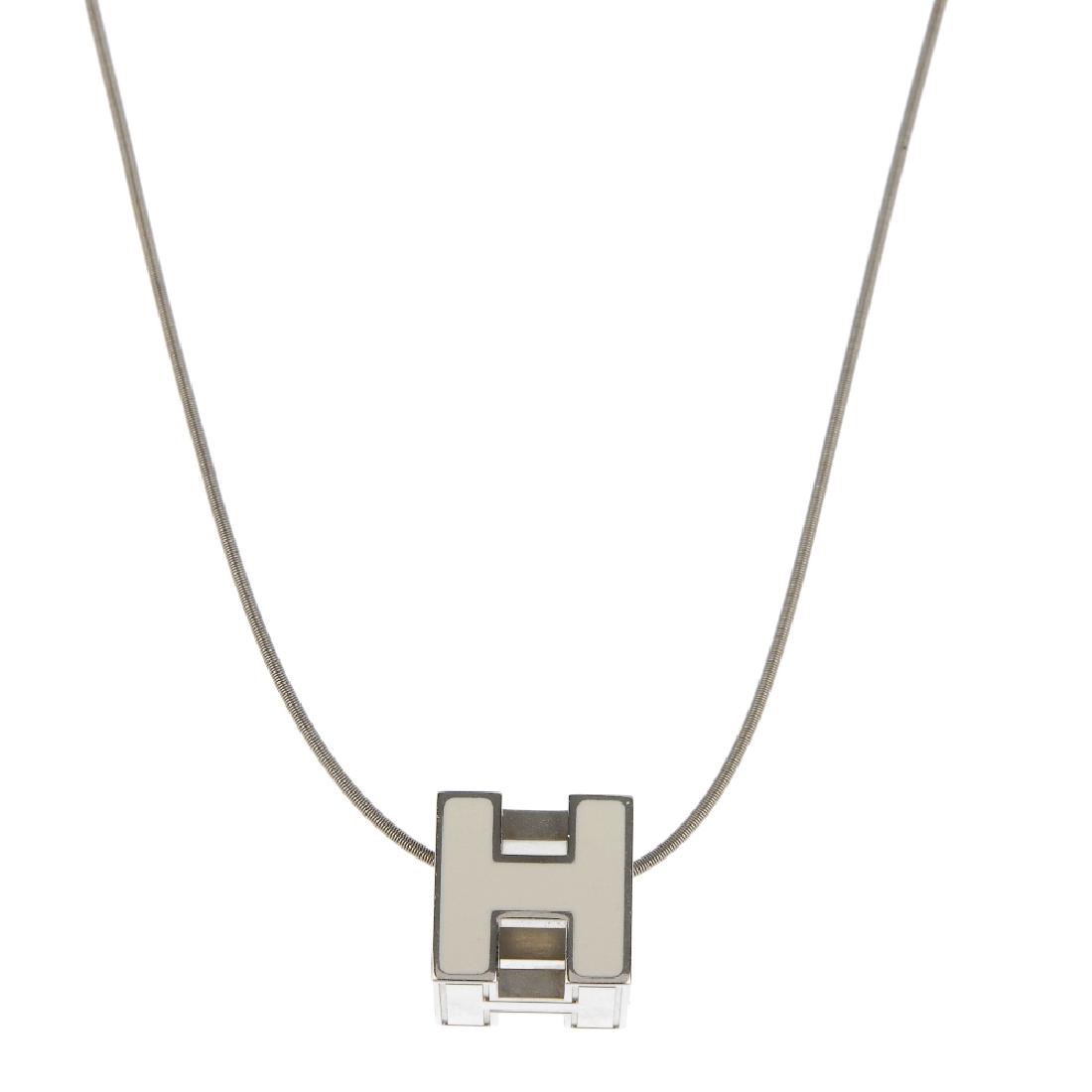 HERMÈS - a Cage d'H necklace. The cube shape pendant, (1 of 3)