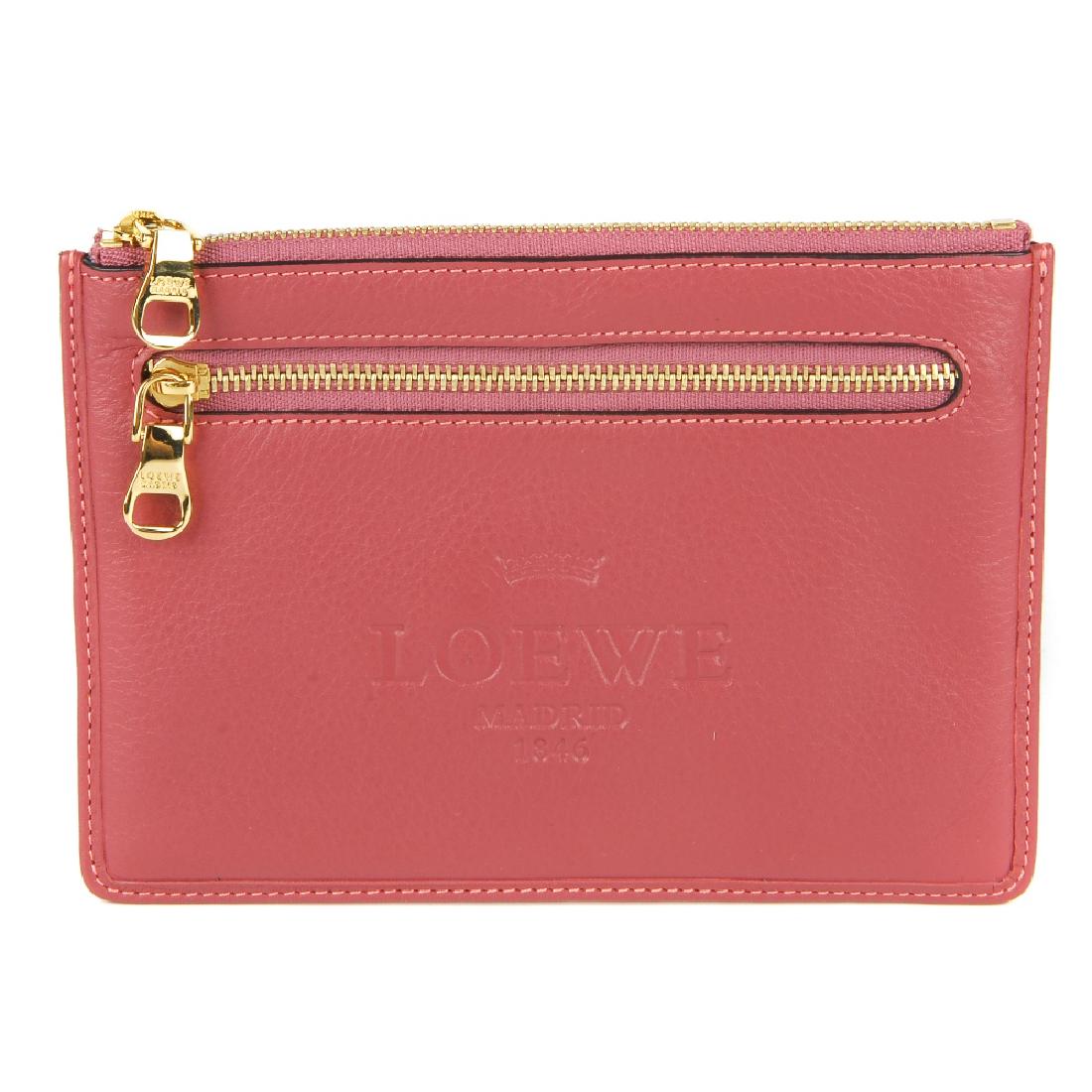 LOEWE - a pink purse. Designed with a pink leather: LOEWE - a pink purse. Designed with a pink leather exterior with maker's name embossed to the centre front, gold-tone hardware, two exterior zip pockets, top zip fastening and smooth brown leather int