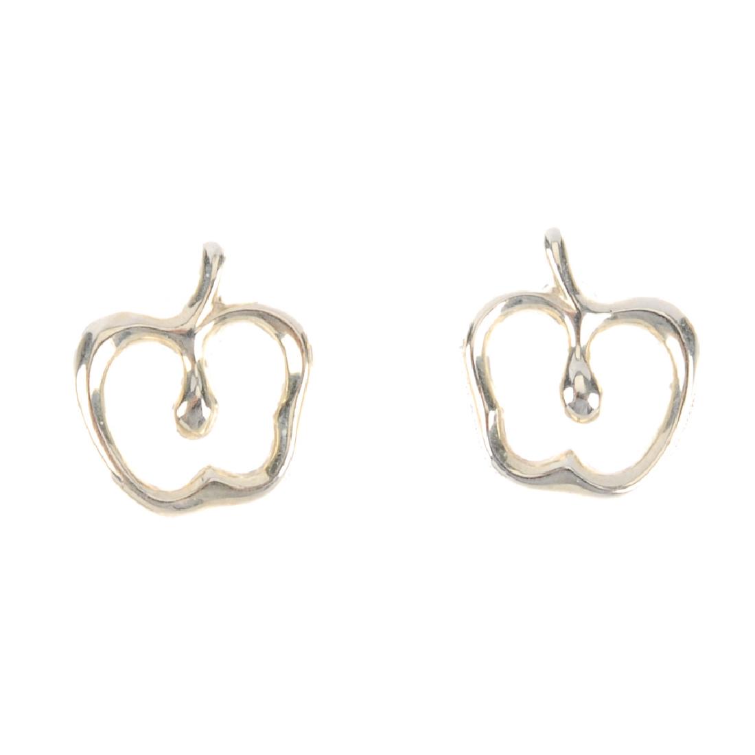 TIFFANY & CO. - a pair of Elsa Peretti ear studs. Of: TIFFANY & CO. - a pair of Elsa Peretti ear studs. Of apple outline, to the stud and butterfly backs. Signed Tiffany & Co. Peretti. Lengths 1cms. Weight 1.6gms. With maker's pouch.
