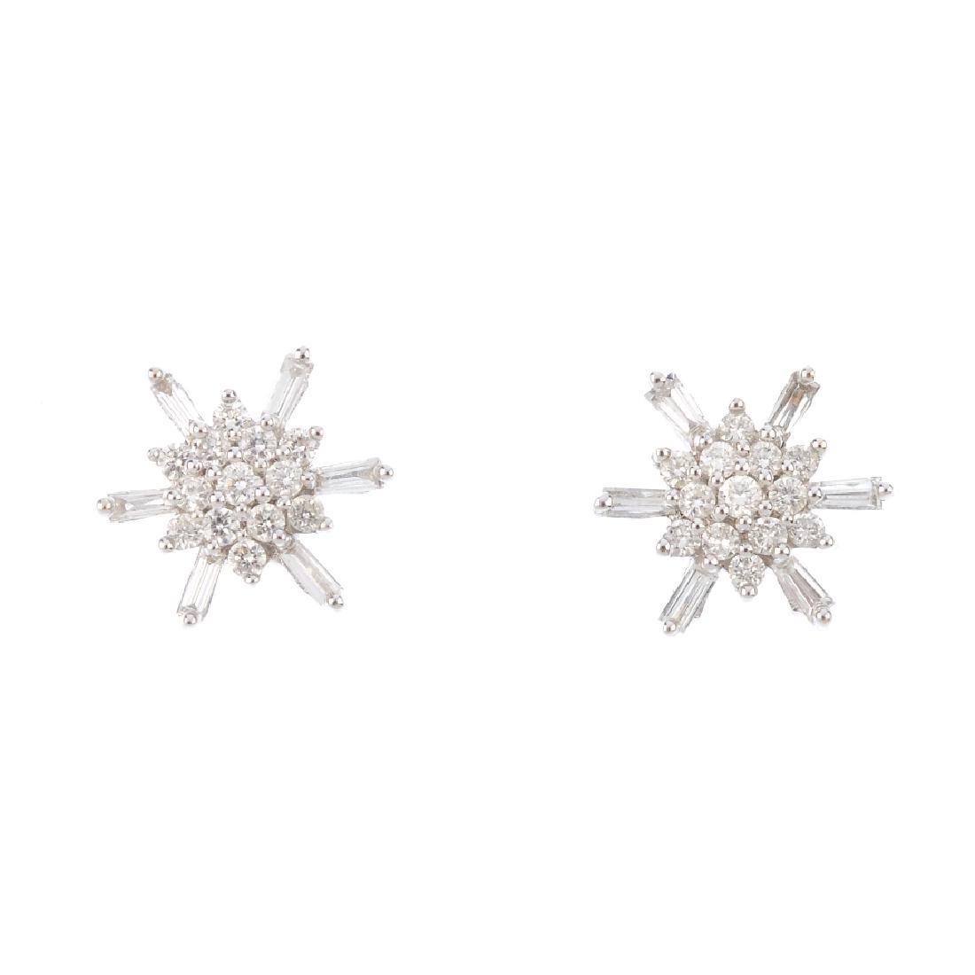 A pair of diamond cluster earrings. Each designed as a (1 of 1)