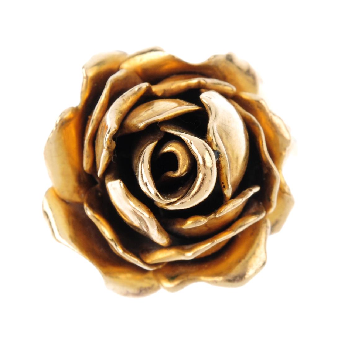 A 9ct gold floral dress ring. Designed as a rose, atop (1 of 1)