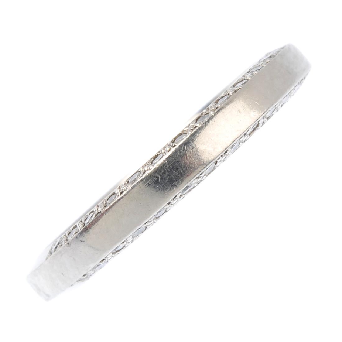 A platinum diamond band ring. The plain band with (1 of 1)