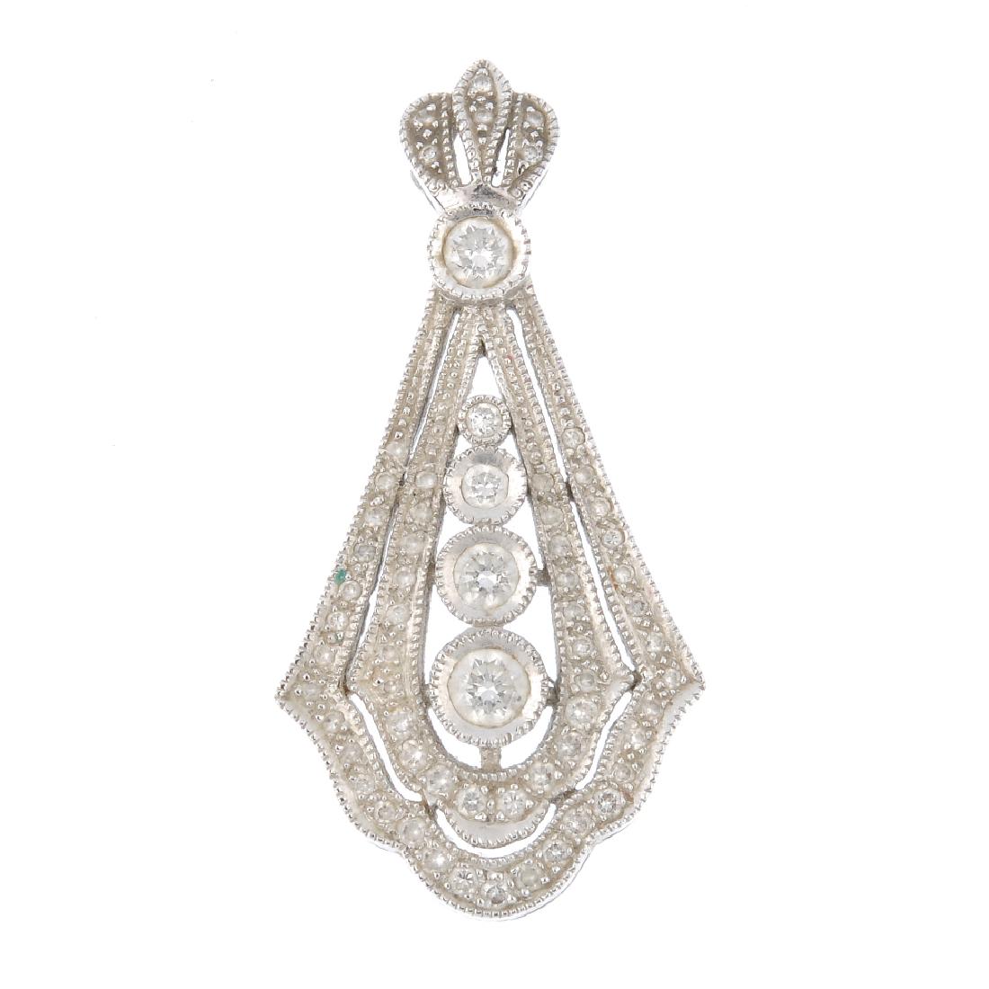 An 18ct gold diamond pendant. The graduated (1 of 1)