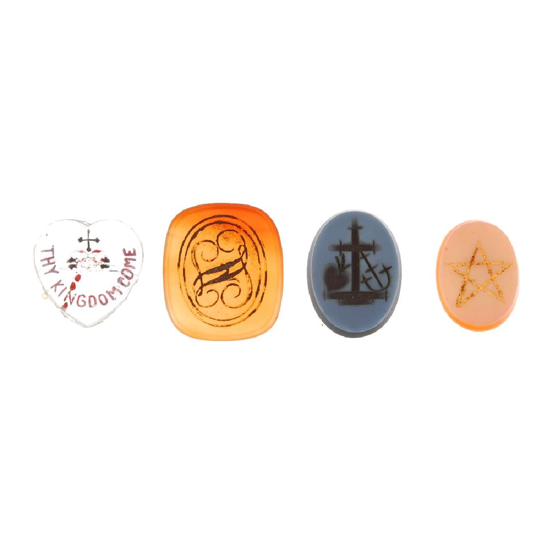 A selection of mainly loose fob seal panels. One: A selection of mainly loose fob seal panels. One carnelian panel of lozenge shape reading 'Friendship', together with a blue glass intaglio panel reading 'Ann' and many carnelian panels with Masonic s