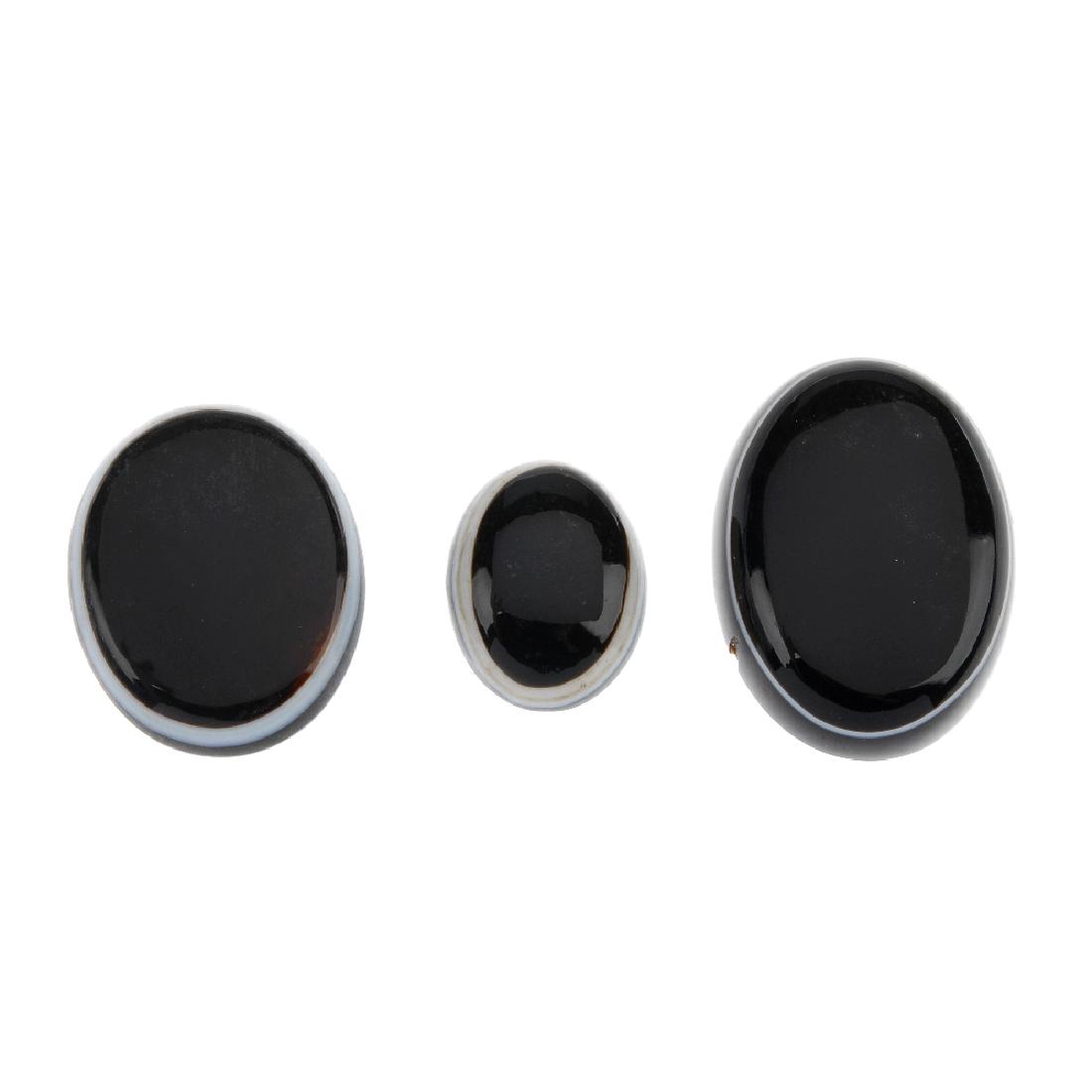 A selection of banded agate panels, studs and part: A selection of banded agate panels, studs and part pieces of jewellery. To include two circular onyx cabochons, four banded agate dress studs, and a number of banded agate panels.