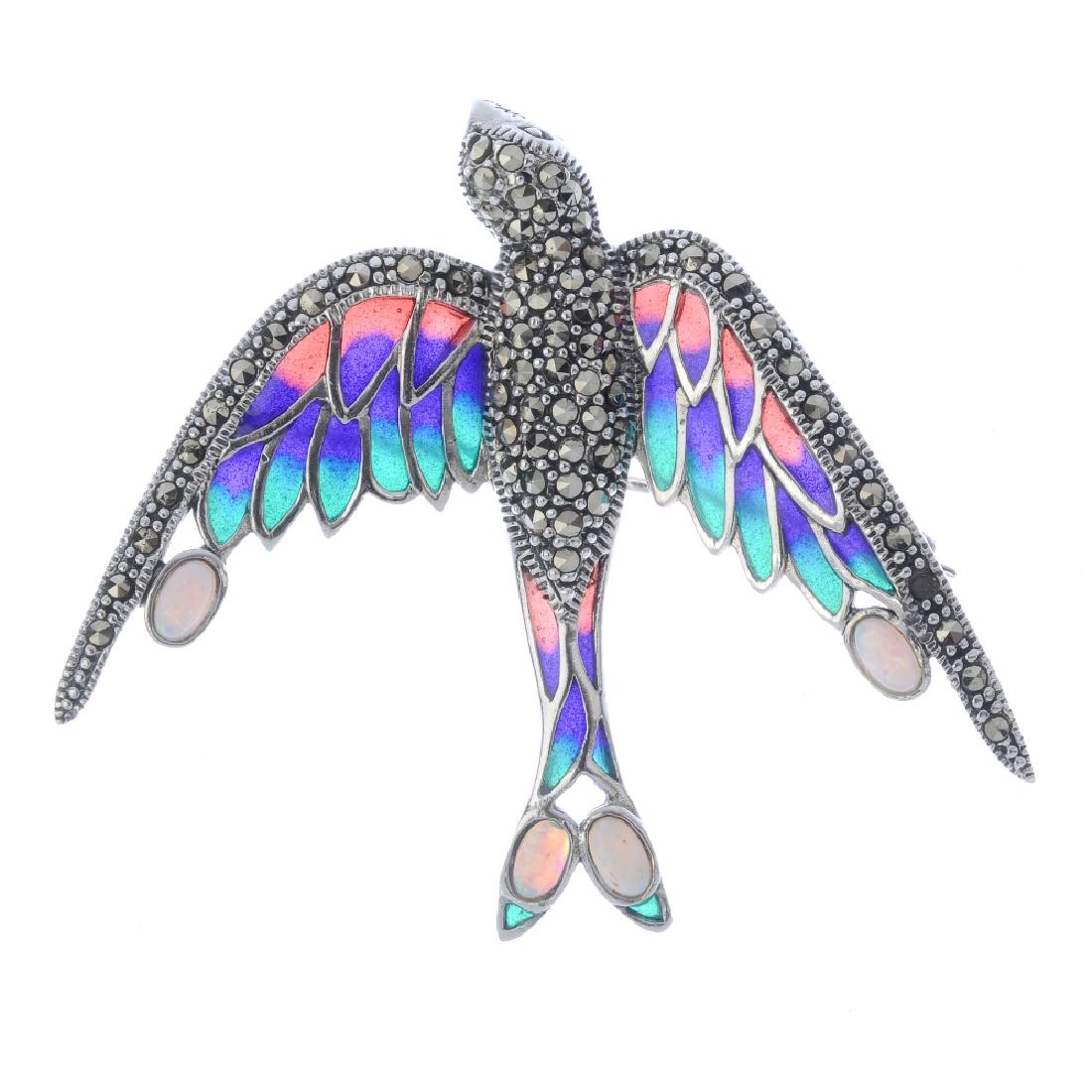 A plique-a-jour, gem and marcasite brooch. Designed as: A plique-a-jour, gem and marcasite brooch. Designed as a swallow with plique-a-jour wings and marcasite edging and body with opal cabochon detail. Can also be worn as a pendant. Stamped 925. Length 6c